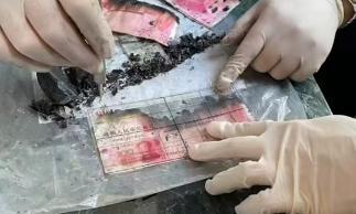 26万现金被烧毁 银行清点7小时兑换