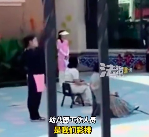 幼儿园小朋友阳光下排舞老师阴凉处指导