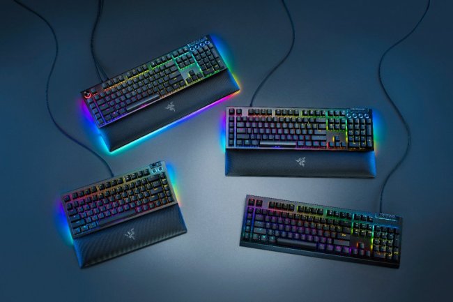 A group of keyboards with colorful lights    Description automatically generated