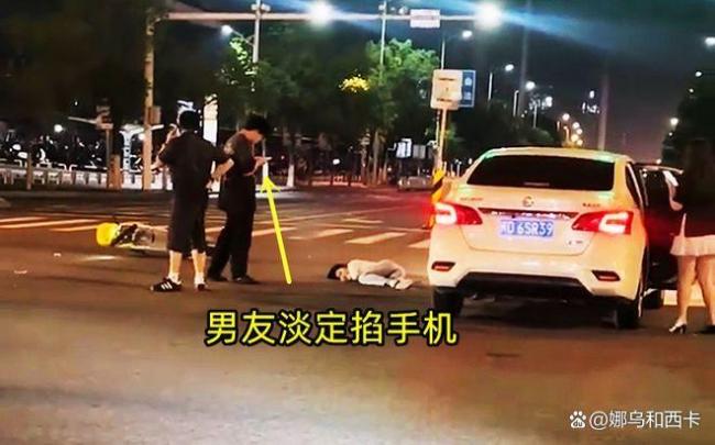 江西年輕情侶騎電動車闖紅燈被撞 男友冷漠引熱議