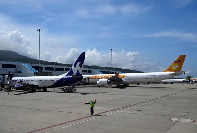 新华社记者在委内瑞拉机场见闻 多方批评美国威胁言论