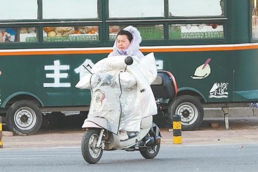 “暖流”驅(qū)寒流，應對大風降溫